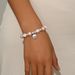 Ins Japanese and Korean small fragrance pink pearl English letters, niche design, set with diamonds, versatile bracelet_ipsvogv.com