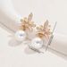 Unique women's with versatile high-end design featuring coconut leaves, diamond studded string, pearl earr, and_ipsvogv.com