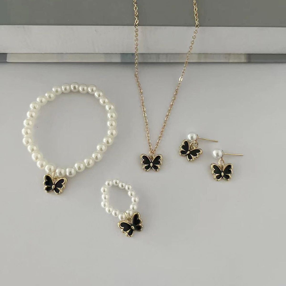 Popular children's jewelry set oil drop butterfly pendant pearl bracelet earrings necklace accessories female_ipsvogv.com