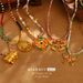 New Chinese Style Butterfly Enamel Necklace Retro Flower Pendant Clavicle Chain Beaded National Trend Hollow Necklace_ipsvogv.com