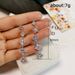Cao Shi's square tassel long earrings, female face trimming, slimming, and versatile ear accessories_ipsvogv.com
