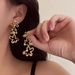 Light Luxury Zircon Silver Needle Gold Flower for Women's Fashion Design with Exaggerated High end and Internet_ipsvogv.com