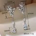 Cao Shi's Long Light Luxury Flower High-end Feeling Earrings Water Droplet Shaped Horse Eye Pendant_ipsvogv.com