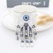 Creative Blue Eye Bag Pendant Devil's Eye Palm Metal Keychain Pendant_ipsvogv.com