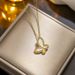 New product with diamond inlaid sweet butterfly necklace, women's gold white titanium steel fashionable collarbone_ipsvogv.com