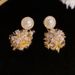 Korean Style Unique Exquisite Metal Fireworks Light Luxury Niche Design Super Shiny Dongdaemun High-end Fashion Earrings_ipsvogv.com