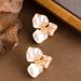 Literary Retro Medieval Style Cream White Three Petal Flower Earrings Light Luxury Temperament High End Silver Needle Earrings_ipsvogv.com
