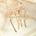 Gold-Plated Copper Bowknot Long Tassel Simple Classic Metal Ribbon Knotted French Style Earrings With Silver Needle_ipsvogv.com