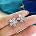 Cao Shi's Korean version is simple and slightly inlaid with diamonds, zircon earrings, lucky grass flowers, small and elegant ear ornaments_ipsvogv.com