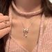 Korean Dongdaemun Sweet Metal Bow Ribbon Ins Style Electroplated Silver Necklace For Women_ipsvogv.com
