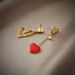 Unisex new creative personality niche asymmetrical hollow love titanium steel hanging earrings_ipsvogv.com