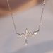Cao Shi's Small people's beating heart pendant necklace. Electrocardiogram, neck chain, clavicle chain, female_ipsvogv.com