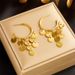 Niche fashion retro high-end light luxury temperament gold disc tassel pendant titanium steel earrings earrings_ipsvogv.com
