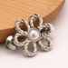 Metal hollow flower waist buckle no nail pants to make the waist smaller artifact skirt waist button_ipsvogv.com