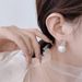 Cao Shi Large Diameter Pearl Fashionable and Minimalist Style Square Diamond Earrings_ipsvogv.com