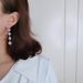 Cao Shi's square tassel long earrings, female face trimming, slimming, and versatile ear accessories_ipsvogv.com