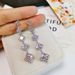 Cao Shi's square tassel long earrings, female face trimming, slimming, and versatile ear accessories_ipsvogv.com