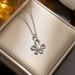 Korean version minimalist flower necklace for women with a high-end sense of fashion, gold flower pearl pendant,_ipsvogv.com