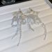 Unisex Forest Style Fresh Crystal Flower Bow Tassel Earrings Super Fairy Fashion Light Luxury Earrings Temperament High End Earrings_ipsvogv.com
