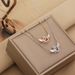2023 New Angel Wings Titanium Steel Necklace Lingering Pendant with Jumping Heart and Small Crowd Design Collar_ipsvogv.com