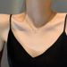 Pearl Double Ring Titanium Steel Necklace With Female Niche Design That Exudes A Sense Of Luxury And Temperament._ipsvogv.com