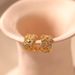 Brass plated K real gold fashionable OL retro ear bone clip inlaid with zircon exquisite light luxury ear clip hollow wide edge design_ipsvogv.com