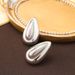 Exaggerated cold style metal large light surface water droplet pearl silver needle high-end female personality earrings_ipsvogv.com