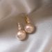 2023 new popular pink pearl earrings female niche design high-grade light luxury French stud earrings_ipsvogv.com
