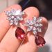 Cao Shimao's New Product Features Pear Shaped Red With Water Droplets Embedded. The Earrings Are Full Of Diamonds And_ipsvogv.com