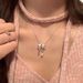 Korean Dongdaemun Sweet Metal Bow Ribbon Ins Style Electroplated Silver Necklace For Women_ipsvogv.com