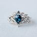 Sanjie Flower Shaped Inlaid Water Droplet Blue Zircon Ring, Female Niche High-end Crown Accessory_ipsvogv.com
