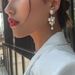 E8291 Dongdaemun New Sweet and Elegant Long Korean Edition Fashion Pearl Grape String Earrings_ipsvogv.com