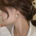 2023 new popular pink pearl earrings female niche design high-grade light luxury French stud earrings_ipsvogv.com
