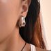 Unisex Spring And Summer INS Retro Gold Plated Titanium Steel Fine Polished Hollow Melon Seeds Gypsy Earrings_ipsvogv.com